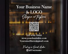 a business card is displayed in front of a glass door with an image of bottles behind it