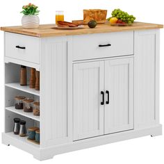 a white kitchen island with wooden top and drawers