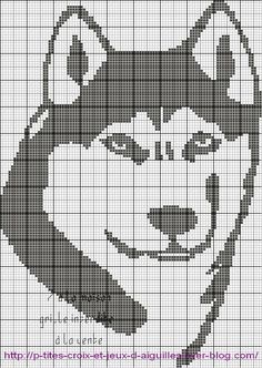 a cross stitch pattern with a dog's head