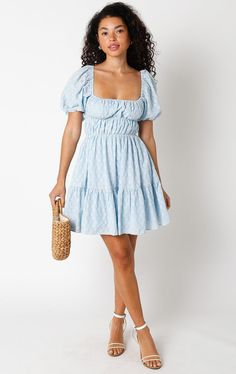 Get ready to feel fabulous in the Kendall Blue Eyelet Puff Sleeve Mini Dress! It's sure to bring a playful and fun vibe to your wardrobe. This puff sleeve mini dress is made from blue and cream pierced eyelet lace fabric, with a smocked corset-inspired bodice, a square neckline, and an attached tiered mini skirt. Style with heels for an elevated look! DETAILS & FIT S: 30" length, 25" waist, 32" bust M: 30.5" length, 27" waist, 33" bust L: 31" length, 29" waist, 35" bust 100% Cotton. Machine wash Light Blue Square Neck Mini Dress For Brunch, Light Blue Mini Dress For Day Out, Fitted Light Blue Mini Dress With Puff Sleeves, Blue Flirty Mini Dress With Square Neck, Flirty Blue Mini Dress With Square Neck, Light Blue Cotton Puff Sleeve Mini Dress, Blue Mini Puff Sleeve Dress For Spring, Blue Puff Sleeve Mini Dress For Summer, Cute Blue Mini Dress