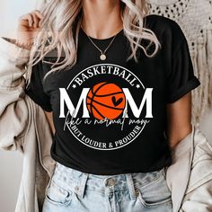 a woman wearing a basketball mom t - shirt