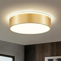 a modern round light fixture in a living room