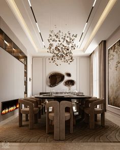 an elegant dining room with modern furniture and art work on the wall, along with a fireplace