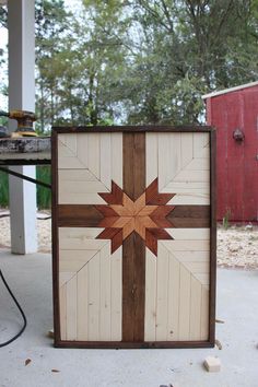 a wooden box sitting on top of a cement ground