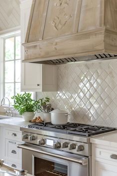 a stove top oven sitting inside of a kitchen