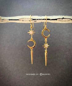 One of my signature mismatched moon + star earring collection. Dainty moon + star charms dangles on gold filled ear wire. This unbalanced dainty mismatched earrings will make a great gift as well. We love you to the Moon and Back! *Total length of the earrings are approx. 50mm *All metals are nickel free and hypoallergenic  **Due to hygiene reasons, I DO NOT ACCEPT RETURN/EXCHANGES on EARRINGS. **  *Jewelry card options- please indicate your choice of a message or your personals message in the m Celestial Dangle Earrings For Everyday, Celestial Style Dangle Earrings For Everyday, Everyday Celestial Dangle Earrings, Celestial Crescent Earrings With Star Charm, Celestial Style Drop Earrings With Dangling Charms, Celestial Gold Dangle Cartilage Earrings, 14k Gold Filled Moon Charm Dangle Earrings, 14k Gold Filled Dangle Earrings With Moon Charm, Crescent Jewelry