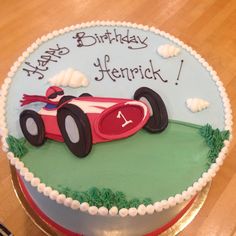 a birthday cake with a racing car on it