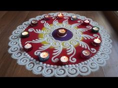 a red and white table with candles on it