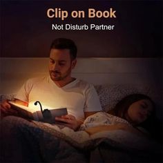 a man and woman laying in bed reading a book with the caption clip on book not disturb partner