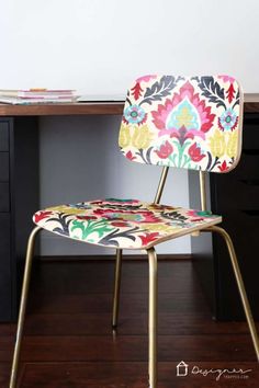 a colorful chair sitting on top of a wooden floor