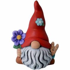 a gnome figurine with flowers on it's head