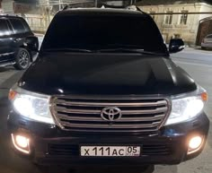 the front end of a black toyota suv