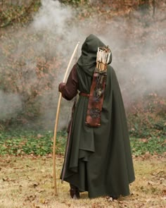 "The perfect cloak for knights, rangers, wizards, and ladies. Our wool cloak provides warmth and rain protection, in addition to stylishly sheltering you from unfriendly eyes! Get it in green, olive, or brown for the perfect forest ranger cloak. Or perhaps try grey or black for a more mysterious aesthetic! Handmade woolen* cloak with hood. Leather clasp at the neck. One size fits most. 57\" in length from neck to hem. *Wool is an 80/20 wool poly blend. Ships in 1-2 weeks. Need it in a hurry? Mes Medieval Ranger, Ranger Cloak, Fantasy Cape, Cloak Medieval, Wool Cloak, Costume Viking, Rangers Apprentice, Costume Capes, Forest Ranger