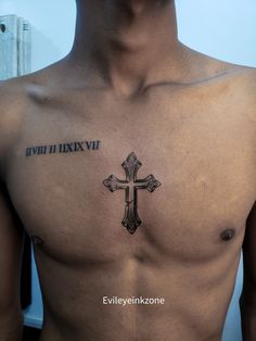 a man with a cross tattoo on his chest