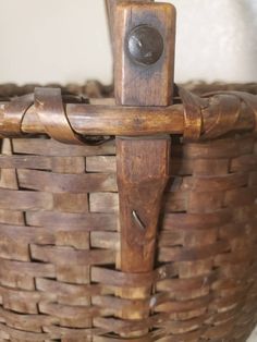 an old wooden basket with handles on it