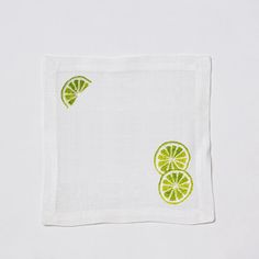 a white napkin with lime slices on it