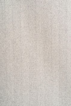 an upholstered white and grey herringbone fabric