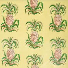 an image of pineapples on yellow background with green and pink flowers in the center