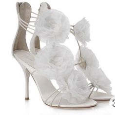 Product Information Straps In White Leather And Organza Floral Details Have Been Used To Form This Gorgeous Pair By Giuseppe Zanotti. The Strappy Layout, Open Toe, And Back Zip Closure Are Added To Frame Your Feet In An Alluring Way. Leather-Lined Insoles And Slim Heels Finish The Luxe Pair. Gender Women Includes The Luxury Closet Packaging Size 39.5 Exterior Material Fabric, Leather Lining Material Leather Insole Material Leather Sole Material Leather Origin Italy Closure Type Zipper Outsole Le Real Ring, Heels For Wedding, Slippers High Heels, Candy Shoes, Zanotti Heels, Wedding Roses, Bridal Shoe, Giuseppe Zanotti Heels, Affordable Shoes