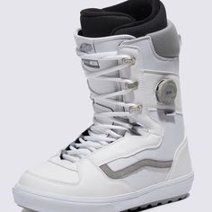 a white snowboard boot with black and grey accents