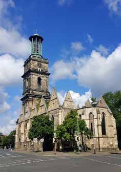 an old church with a clock tower on top