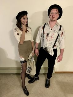 a man and woman dressed up as zombies