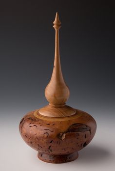 a wooden vase sitting on top of a table