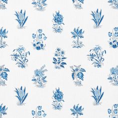 a blue and white wallpaper with flowers on it