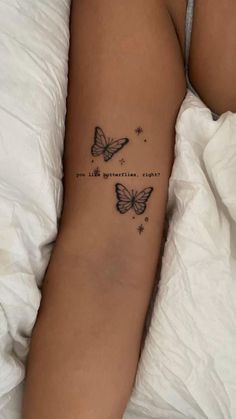 a woman's arm with two butterflies on it and the words, i love you