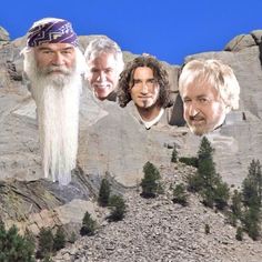 three men with long white hair and beards standing on top of a rocky mountain