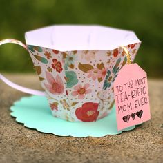 a tea cup with a tag that says to the most tea - specific mom ever