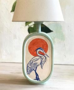 a lamp that has a bird on it