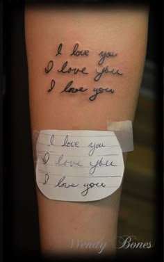 a person with a piece of paper on their arm that says i love you, i love you