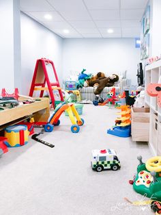 a room filled with lots of toys and stuffed animals on the floor next to each other