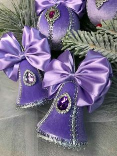 purple christmas decorations with bows and jewels