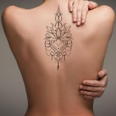 a woman with a tattoo on her back