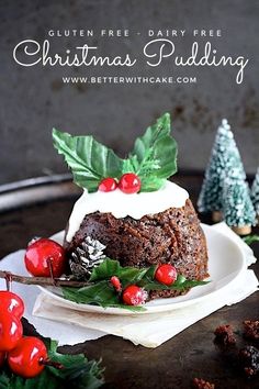 there is a cake on the plate with holly decorations