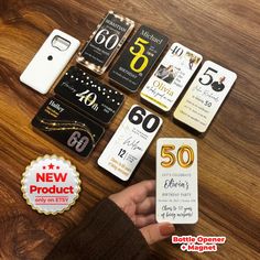 a person holding up some cell phones with price tags on them and the number 50