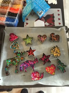 a tray filled with lots of different shaped cookies