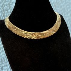 20" in x 14mm wide herringbone chain. Liquid effect v-shaped links lie entirely flat. Herringbone necklace features flexible links. 14K gold plated brass for a dazzling shine. Silky necklace that feels smooth as butter. Made in Korea, for a superior quality chain. Enjoy 100% FREE SHIPPING in the USA.