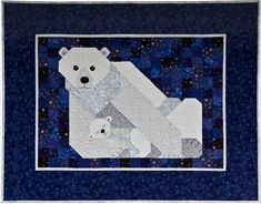 a polar bear and her cub quilted in blue