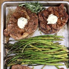 grilled steaks and asparagus on a tray