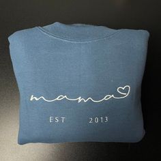 Mama Embroidered Sweatshirt Baby Shower Sweatshirt Mothers Gift New Mom Momma Mama Embroidered Sweatshirt Baby Shower Sweatshirt Mothers Gift New Mom Momma is best Embroidery Clothing for you or gift for friend, family. Shopping more hoodie at here , . If youre looking for the perfect gift for a new mom, then look no further than DreamArtCanada’s Mama Embroidered Sweatshirt. This comfortable and stylish apparel is designed to celebrate motherhood and make any new mom feel special. The sweat... Mama Embroidered Sweatshirt, Custom Made Shirts, Sport Lifestyle, Embroidered Clothes, Mom Sweatshirt, Embroidered Sweatshirt, Embroidered Hoodie, Lifestyle Clothing, Dream Art