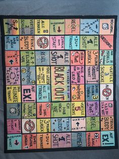 a colorful quilt with words and symbols on it