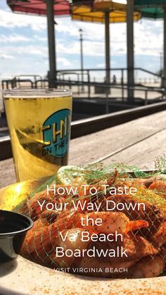 a plate of food on a table next to a drink