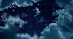 the night sky is filled with stars and clouds as if they were floating in space