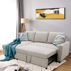 a living room scene with focus on the sectional sofa and coffee table in the foreground