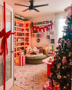 a living room decorated for christmas with presents on the floor and a tree in the corner