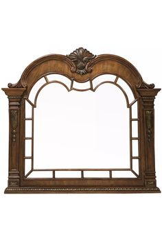 an ornate wooden mirror frame with carvings on the top and bottom edge, in brown wood