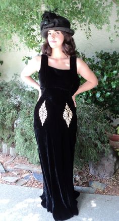 This listing is for a lovely black velvet gown dating to the early 1930s. Great wearable condition, I find no flaws with this dress. The unique little lace pockets are just that. You can put lipstick, jewelry, anything small in the actual pockets. It has a nice flow on the bottom and is bias cut making it fit all the right curves. Side metal zipper. Fits a size 6 or smaller. The model is actually a 2-4 and it looks great on her. Please inquire for specific measurements. Originally $395. Vintage Velvet Dress For Evening, Vintage Black Velvet Party Dress, Vintage Black Velvet Dress For Party, Vintage Black Velvet Dress For Evening, Velvet Vintage Dress For Vintage Events, Vintage Fitted Velvet Dress, Fitted Vintage Velvet Dress, Vintage Glamour Dress, Hollywood Glam Dress